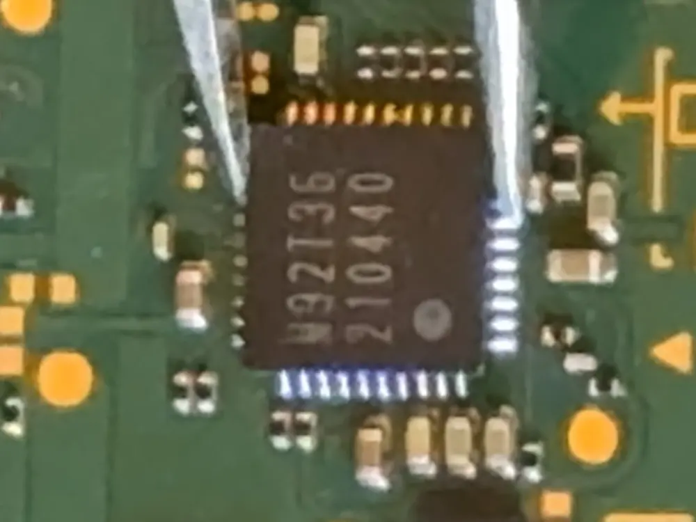 The same board at 16×, with the M92T36 package and its pins filling the frame.